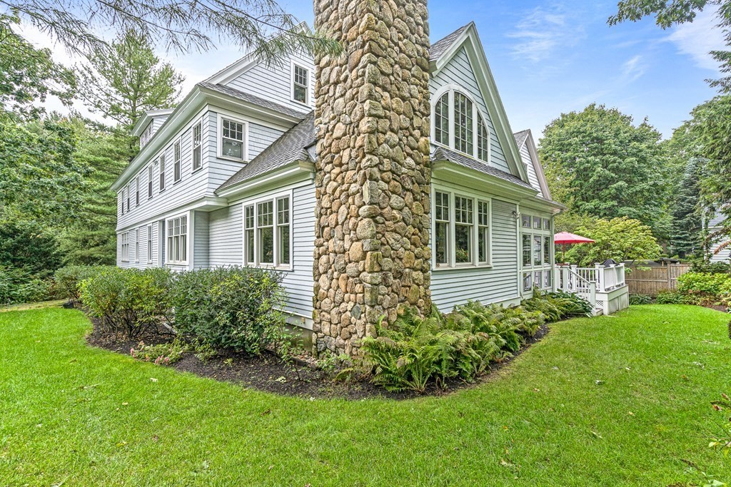 47 Cypress Road Wellesley, MA 02481 - Photo 35 of 36 a front view of a house with a garden