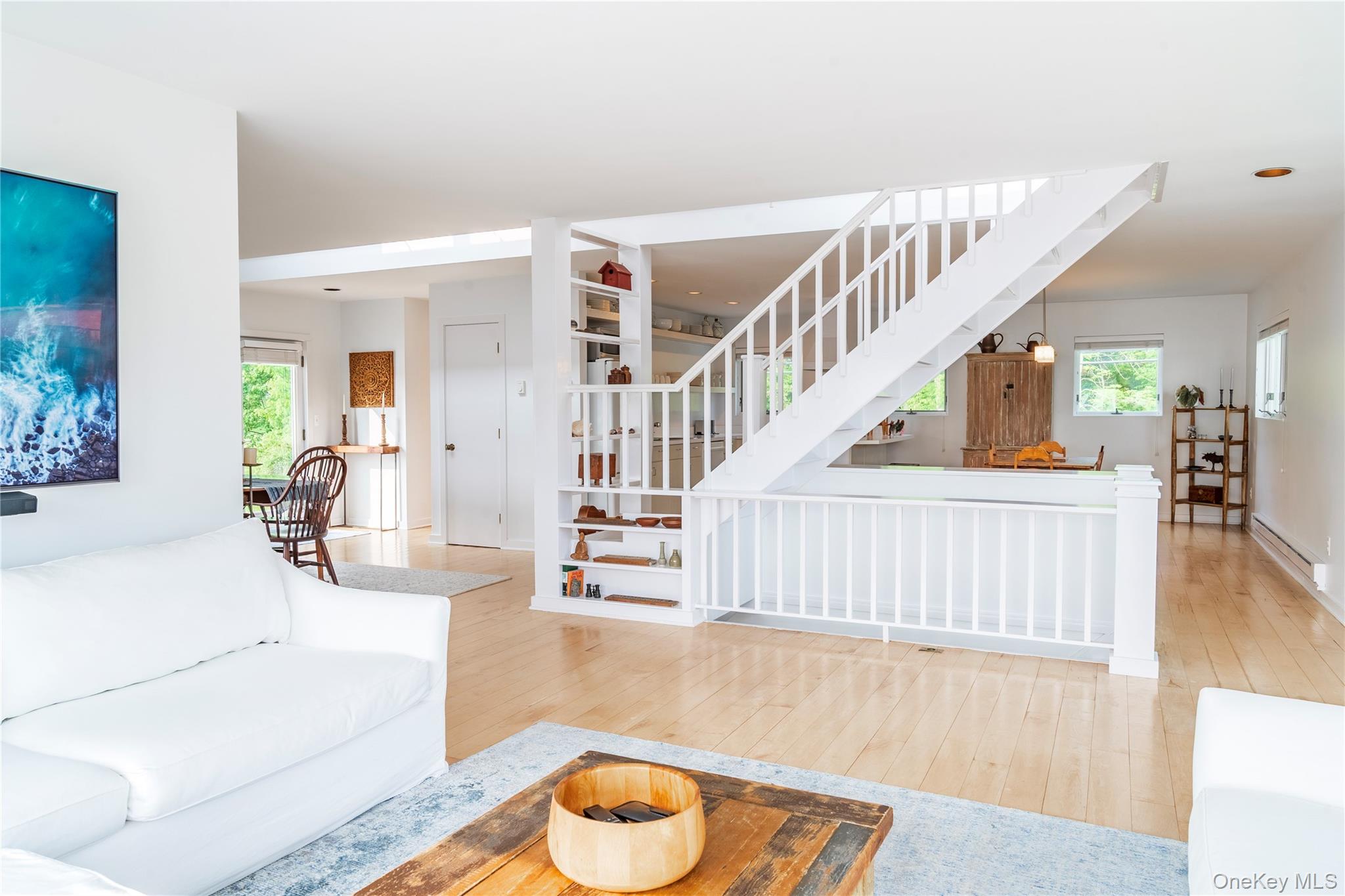 13 West Shore Road Kauneonga Lake, NY 12749 - Photo 6 of 16 a living room with fireplace furniture and a wooden floor