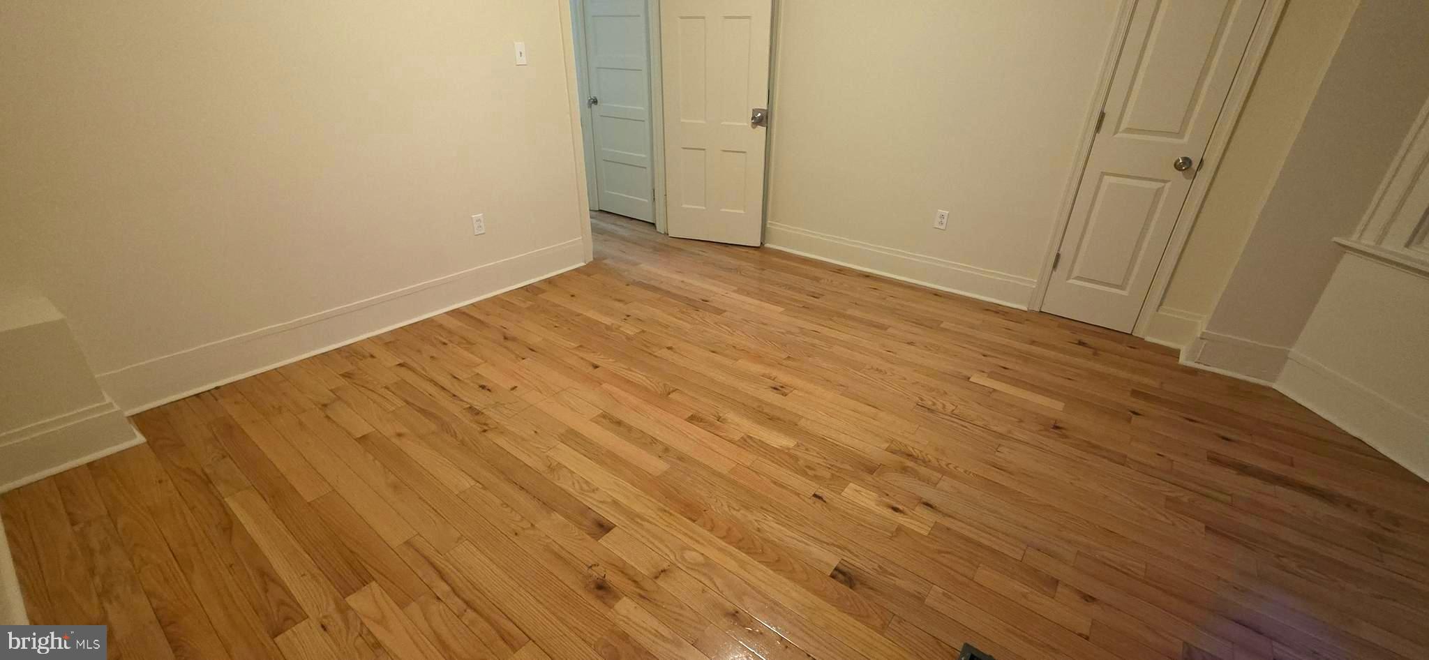 4527 North Carlisle Street Philadelphia, PA 19140 - Photo 16 of 28 a view of empty room with wooden floor