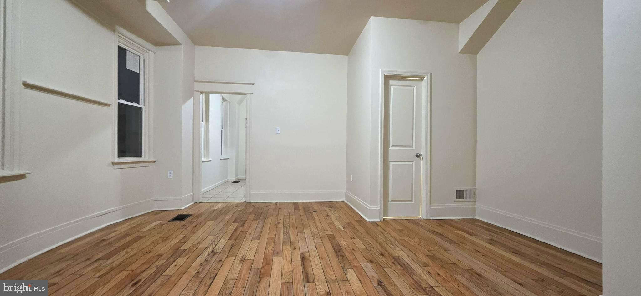 4527 North Carlisle Street Philadelphia, PA 19140 - Photo 6 of 28 wooden floor in an empty room