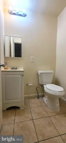 a view of a hallway with wooden floor and stairs