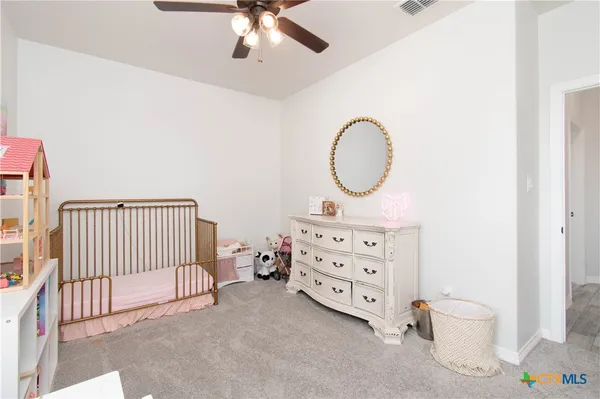a room with furniture and a book shelf