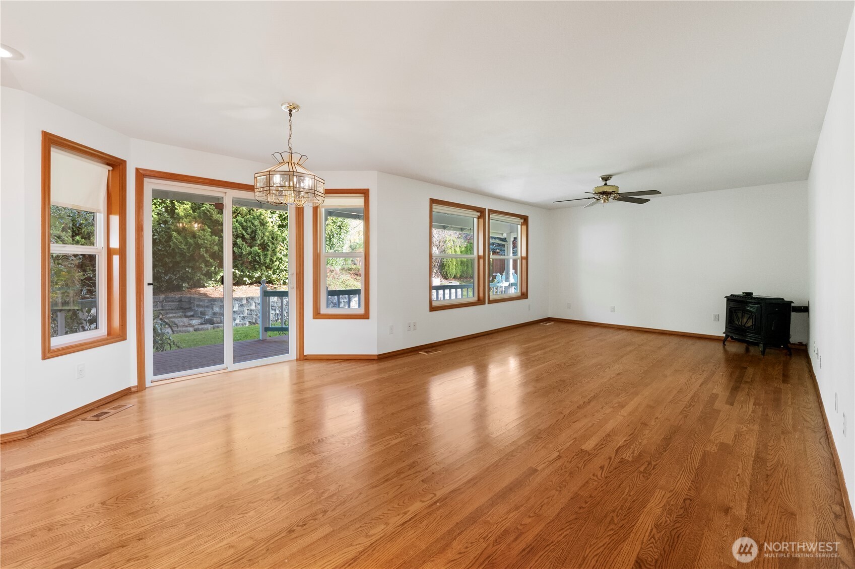 14010 282nd Lane Northeast Duvall, WA 98019 - Photo 11 of 34 a view of an empty room with wooden floor and a window