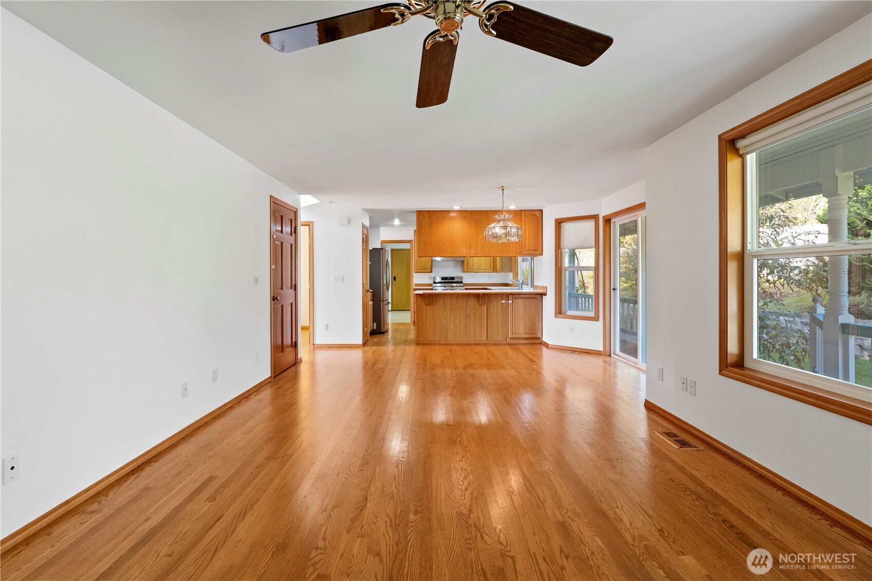 14010 282nd Lane Northeast Duvall, WA 98019 - Photo 12 of 34 wooden floor in an empty room with a window