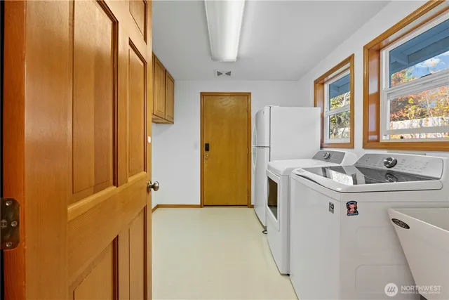 a utility room with dryer and washer