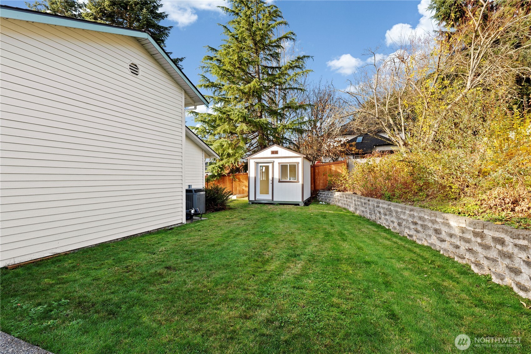 14010 282nd Lane Northeast Duvall, WA 98019 - Photo 27 of 34 a white house that has a tree in front of it