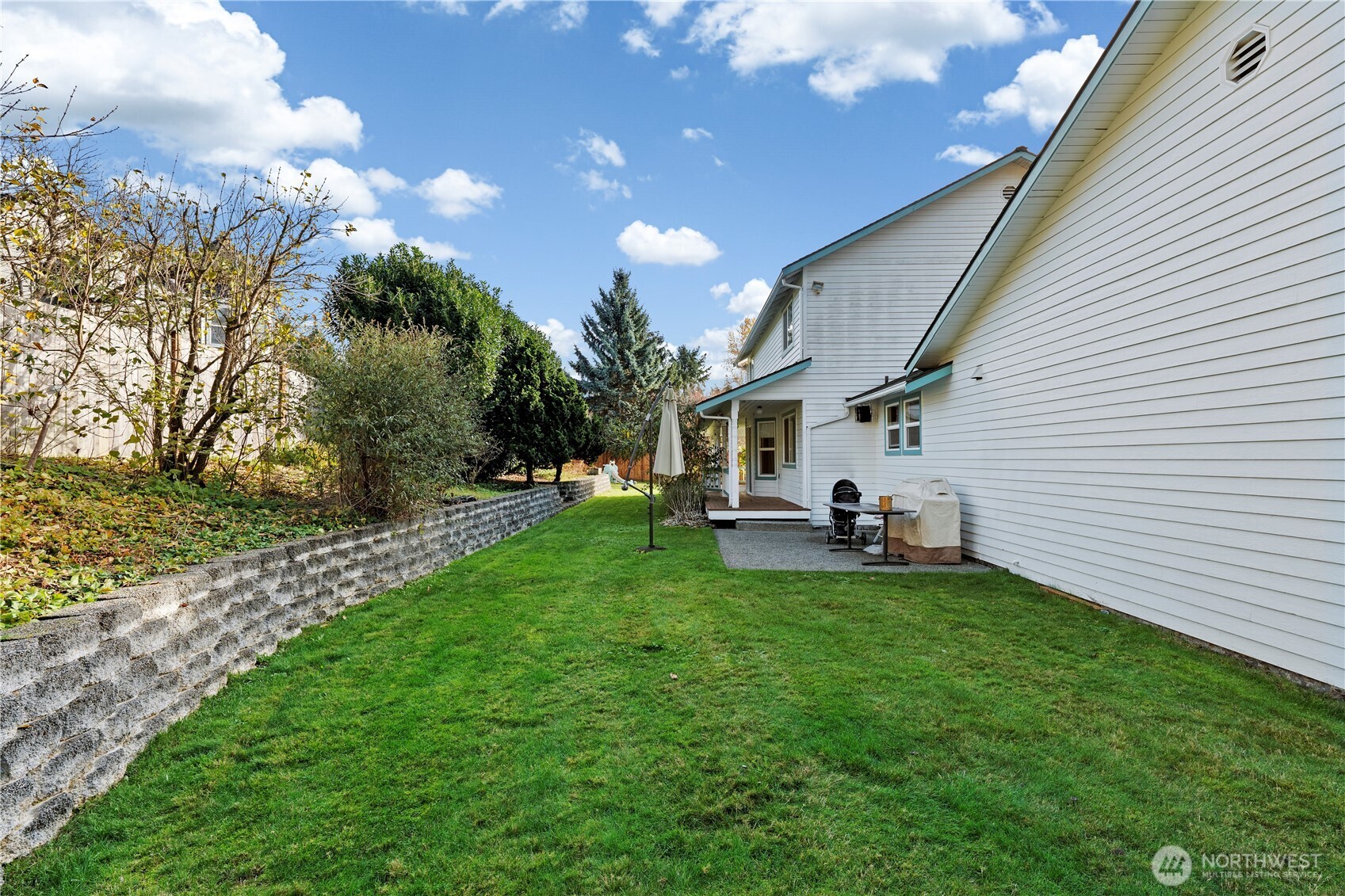 14010 282nd Lane Northeast Duvall, WA 98019 - Photo 28 of 34 a view of a house with backyard and sitting area