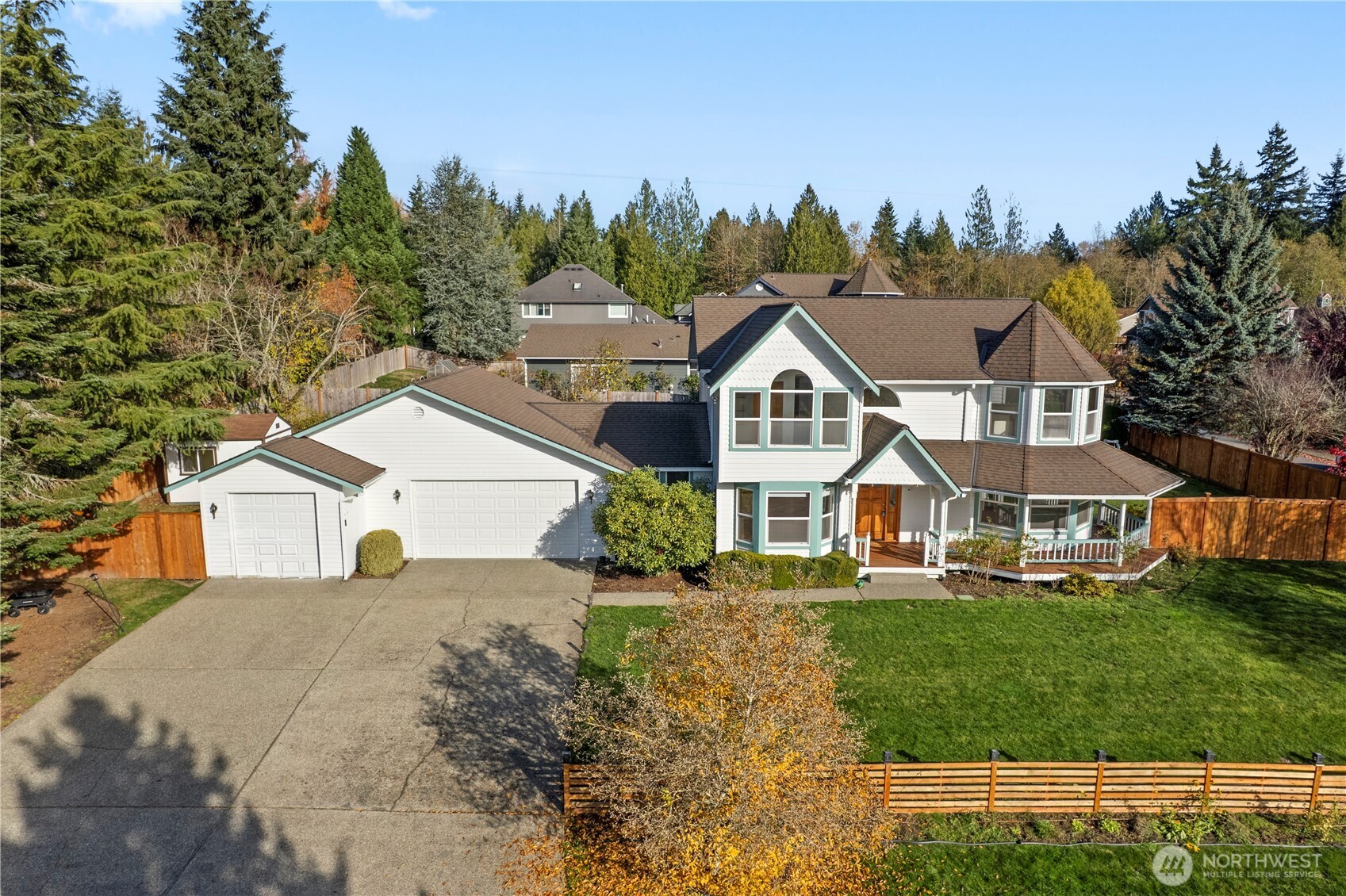 14010 282nd Lane Northeast Duvall, WA 98019 - Photo 33 of 34 a view of a white house next to a yard with big trees