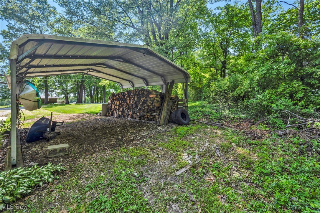 11996 Bower Road East Rochester, OH 44625 - Photo 37 of 49 View of yard with a detached carport