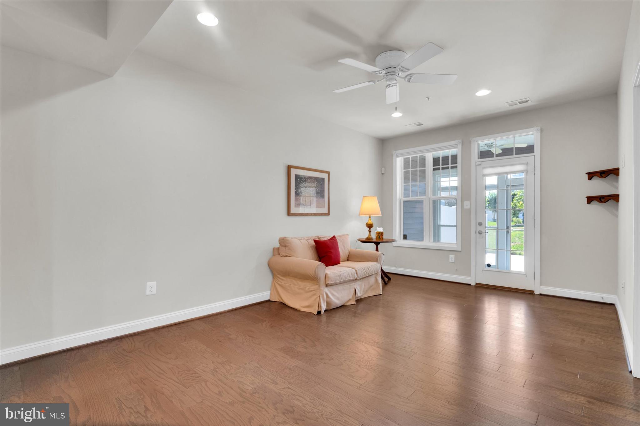 1219 Beaver Tree Drive Odenton, MD 21113 - Photo 14 of 48 a living room with furniture and wooden floor