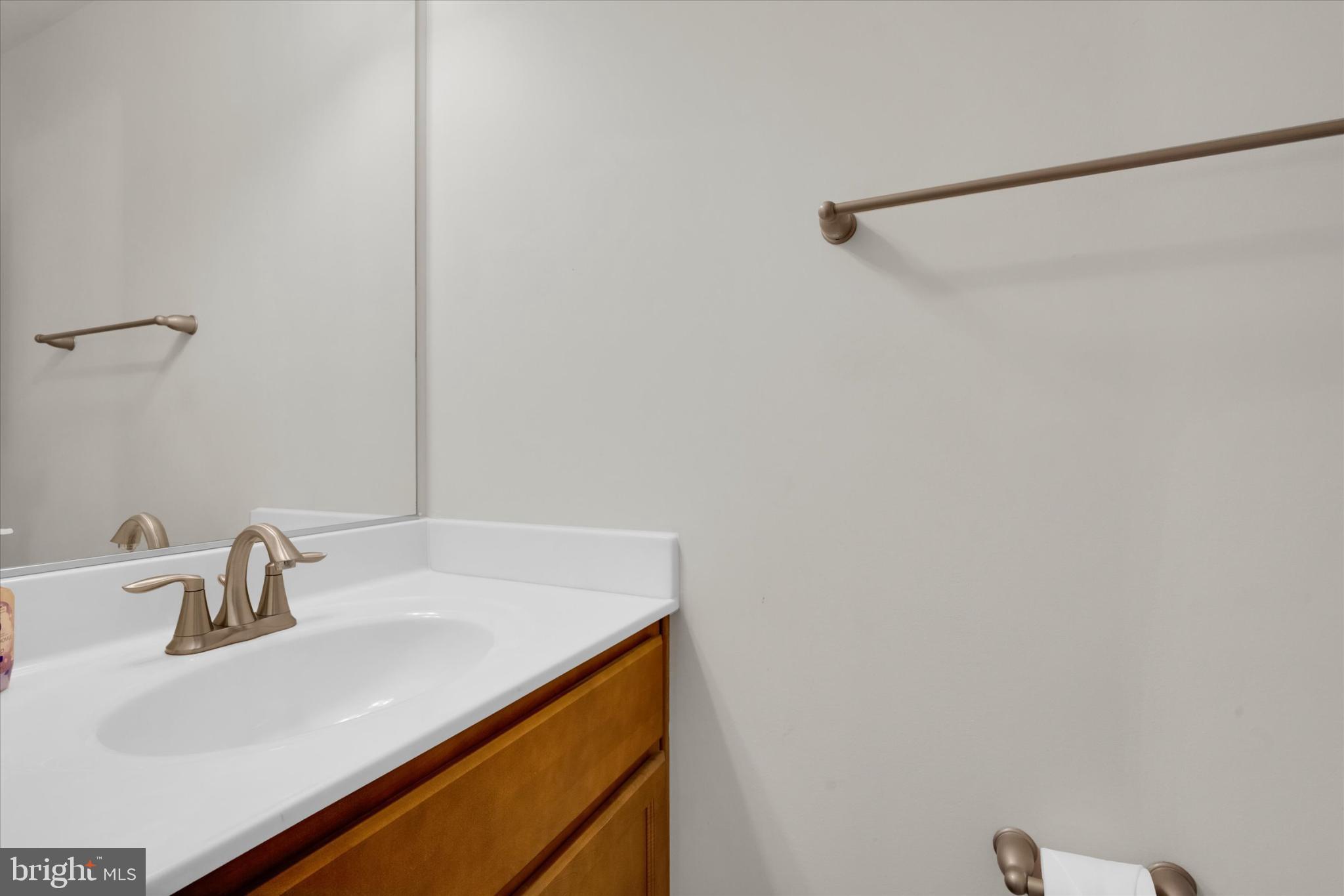 1219 Beaver Tree Drive Odenton, MD 21113 - Photo 19 of 48 a bathroom with a sink and a mirror
