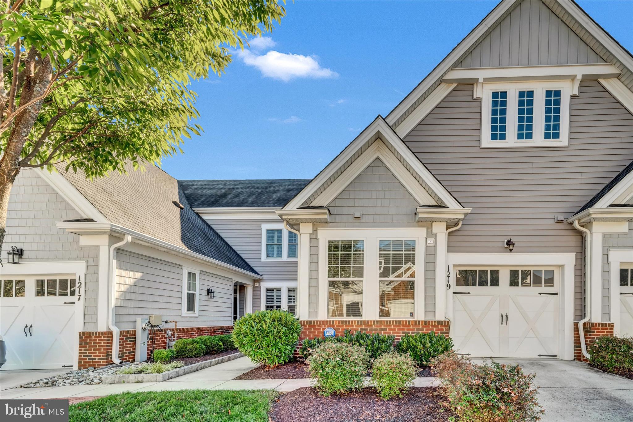 1219 Beaver Tree Drive Odenton, MD 21113 - Photo 2 of 48 a front view of a house with a yard