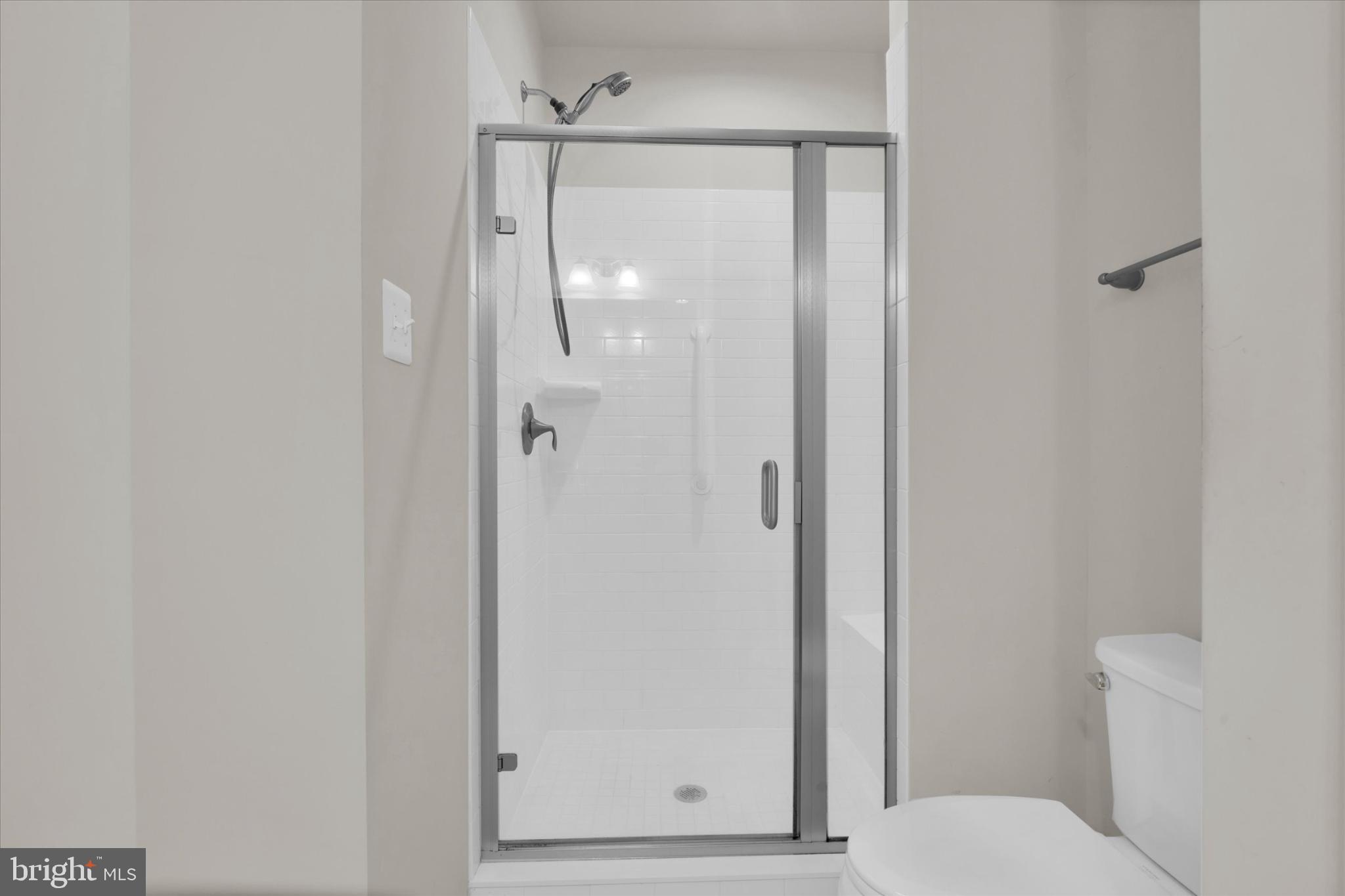 1219 Beaver Tree Drive Odenton, MD 21113 - Photo 34 of 48 a bathroom with a glass shower door