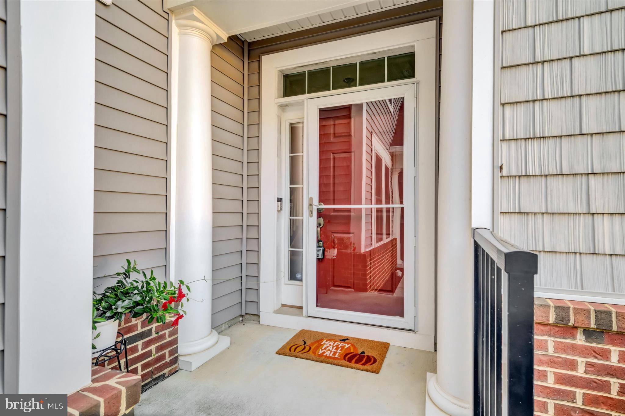 1219 Beaver Tree Drive Odenton, MD 21113 - Photo 4 of 48 a front view of a house with a yard