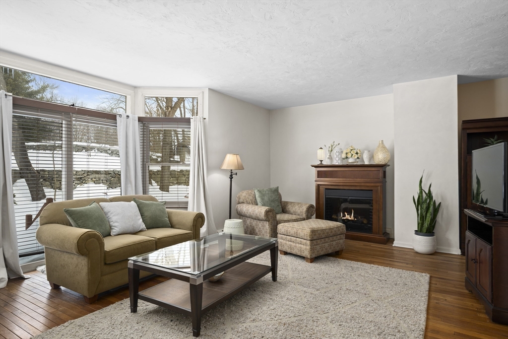 7 Fieldstone Drive, Unit 7 Upton, MA 01568 - Photo 12 of 30 a living room with furniture and a fireplace