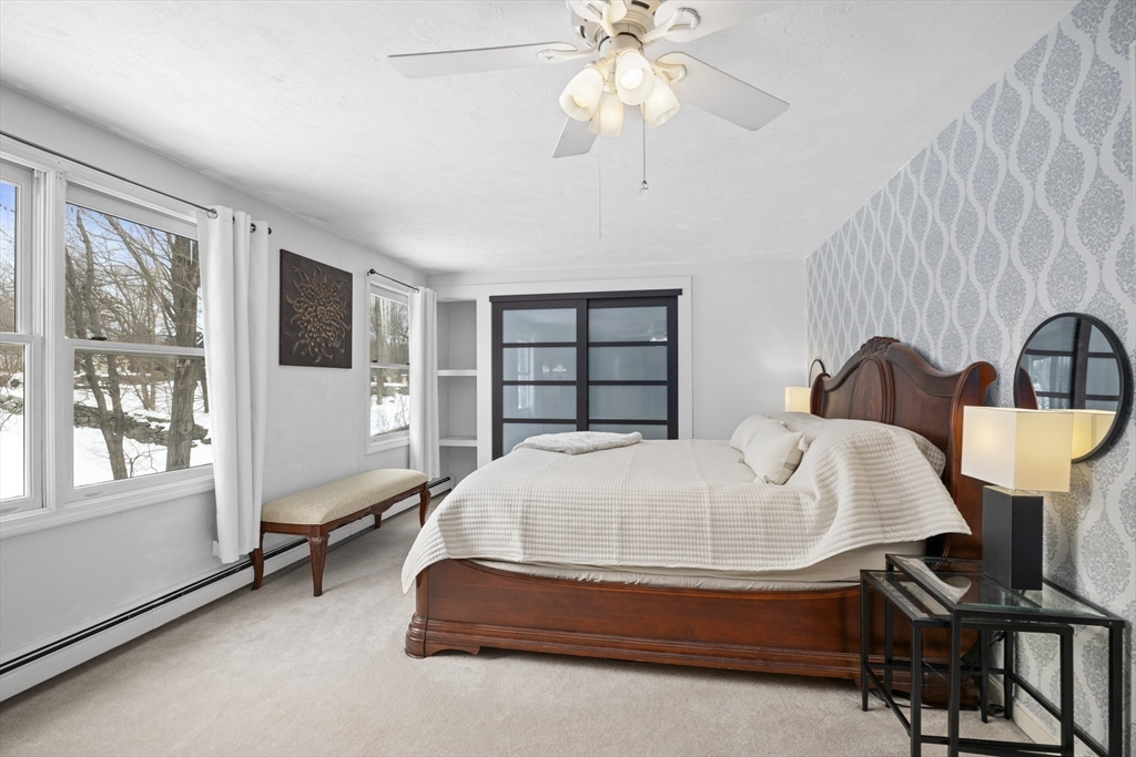 7 Fieldstone Drive, Unit 7 Upton, MA 01568 - Photo 17 of 30 a bed room with a bed and a window