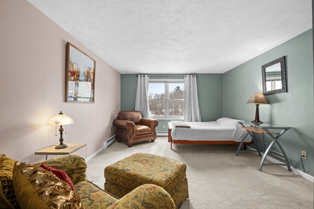 7 Fieldstone Drive, Unit 7 Upton, MA 01568 - Photo 20 of 30 a bedroom with furniture and a window