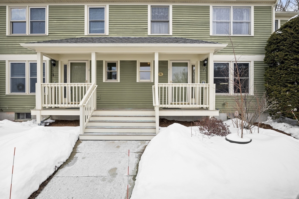 7 Fieldstone Drive, Unit 7 Upton, MA 01568 - Photo 2 of 30 a front view of a house with a yard