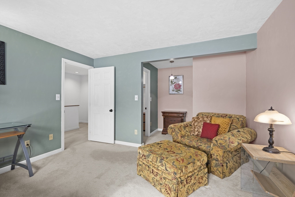 7 Fieldstone Drive, Unit 7 Upton, MA 01568 - Photo 21 of 30 a bedroom with a bed and a lamp on dresser