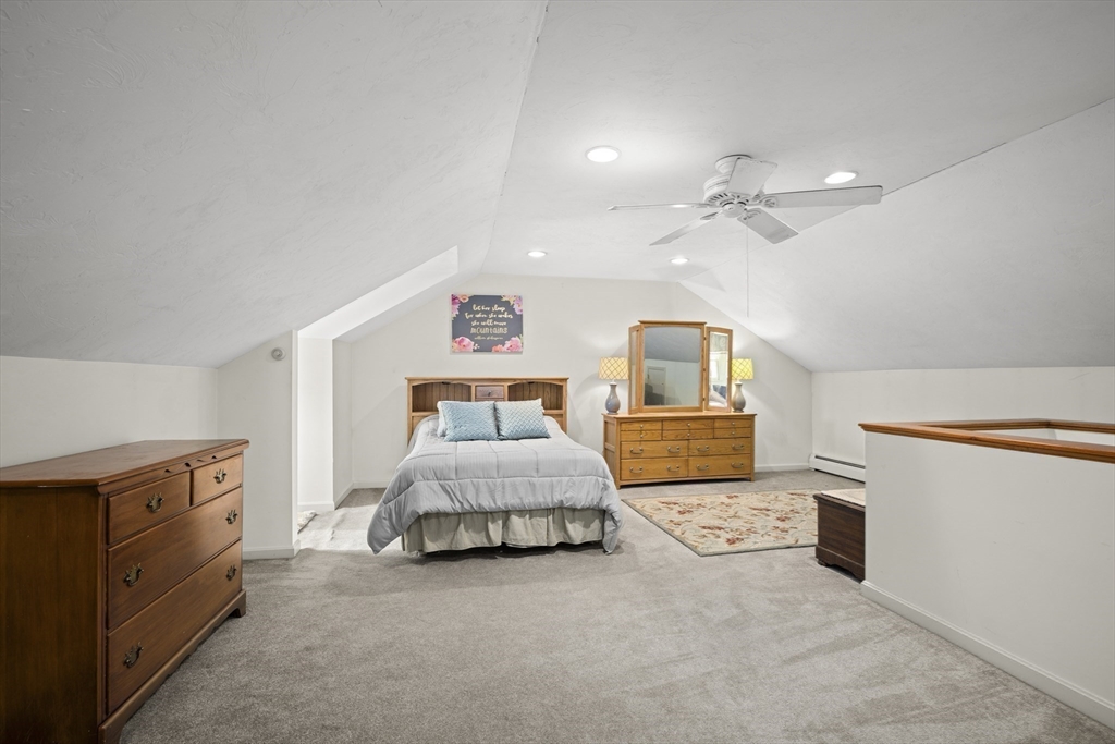 7 Fieldstone Drive, Unit 7 Upton, MA 01568 - Photo 23 of 30 a spacious bedroom with a bed and cabinets