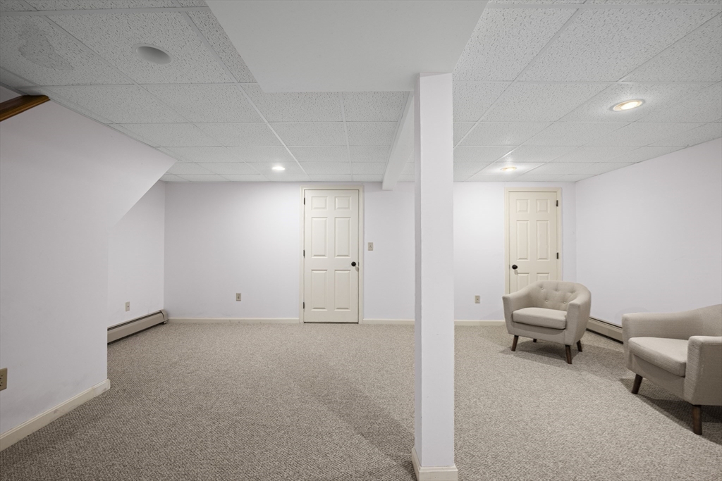 7 Fieldstone Drive, Unit 7 Upton, MA 01568 - Photo 24 of 30 a view of a livingroom with furniture and windows