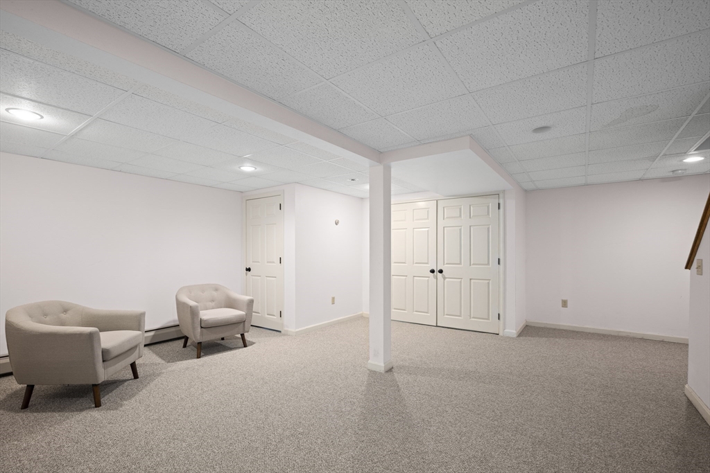 7 Fieldstone Drive, Unit 7 Upton, MA 01568 - Photo 25 of 30 a view of a livingroom with furniture and storage