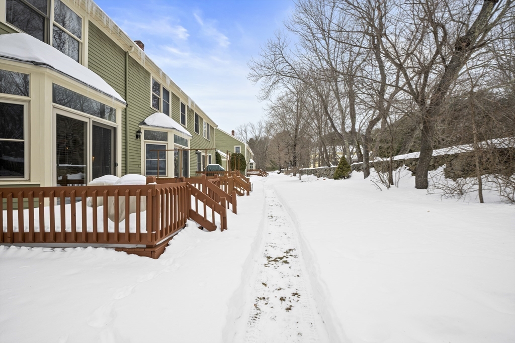 7 Fieldstone Drive, Unit 7 Upton, MA 01568 - Photo 26 of 30 a street view covered with snow