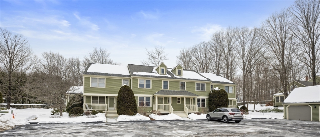 7 Fieldstone Drive, Unit 7 Upton, MA 01568 - Photo 29 of 30 a front view of a residential apartment building with a yard
