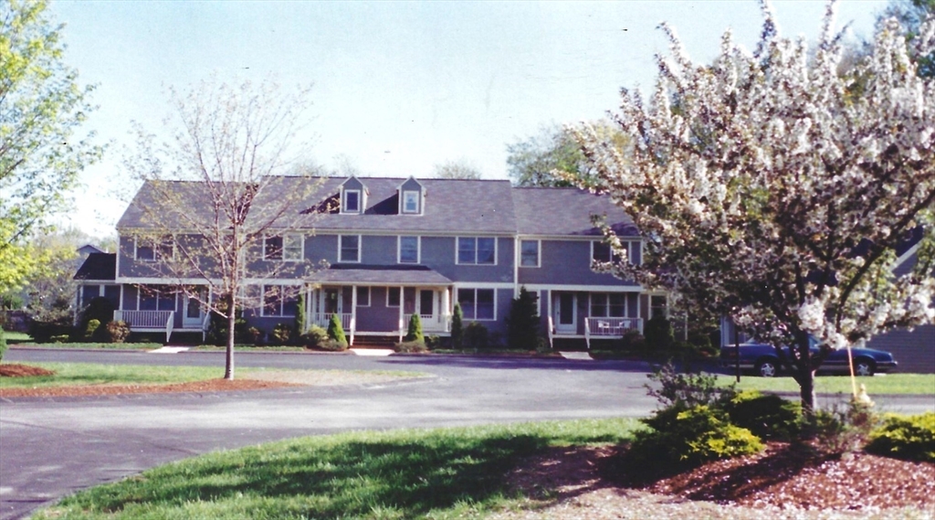 7 Fieldstone Drive, Unit 7 Upton, MA 01568 - Photo 4 of 30 a front view of a house with a yard