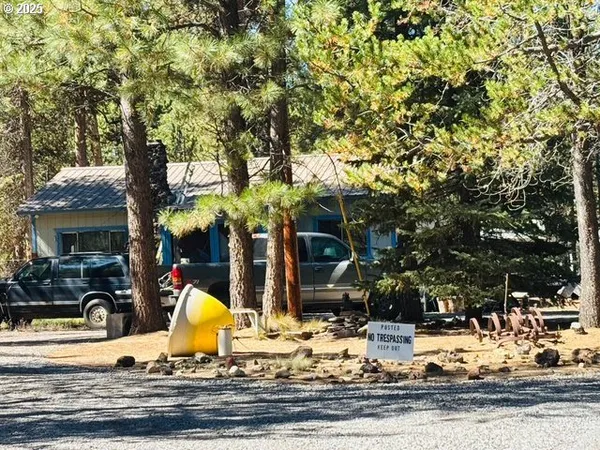 a view of a backyard of the house