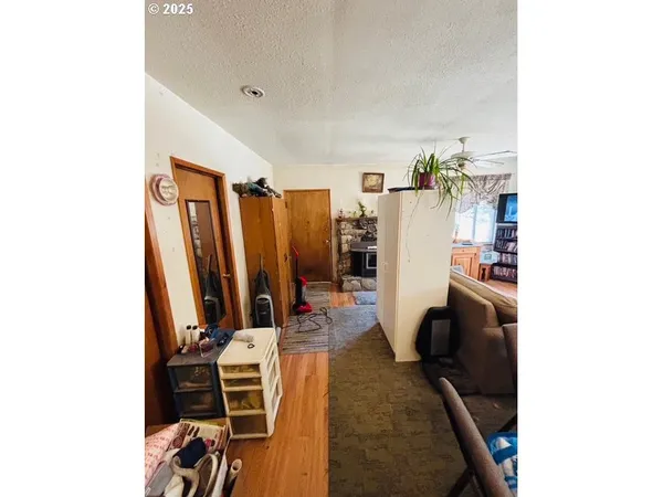 a view of a living room with furniture and a flat screen tv