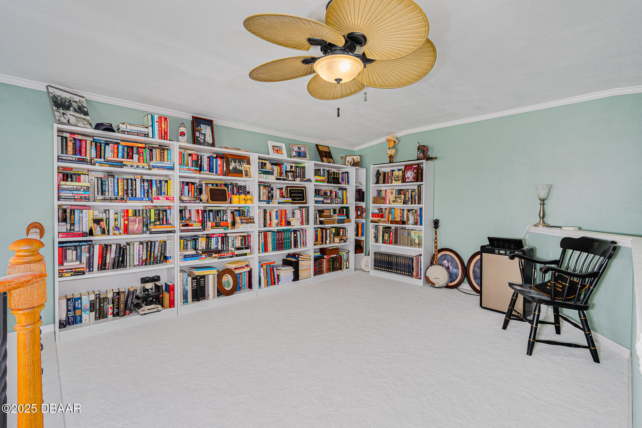 46 Oceanview Avenue Ponce Inlet, FL 32127 - Photo 40 of 79 a view of a work space with furniture and a book shelf
