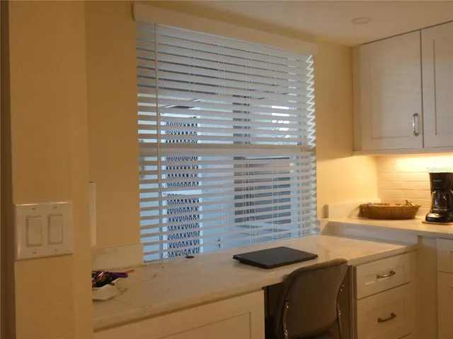 a bathroom with a sink and a window