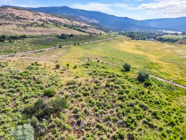 a view of an ocean and a mountain