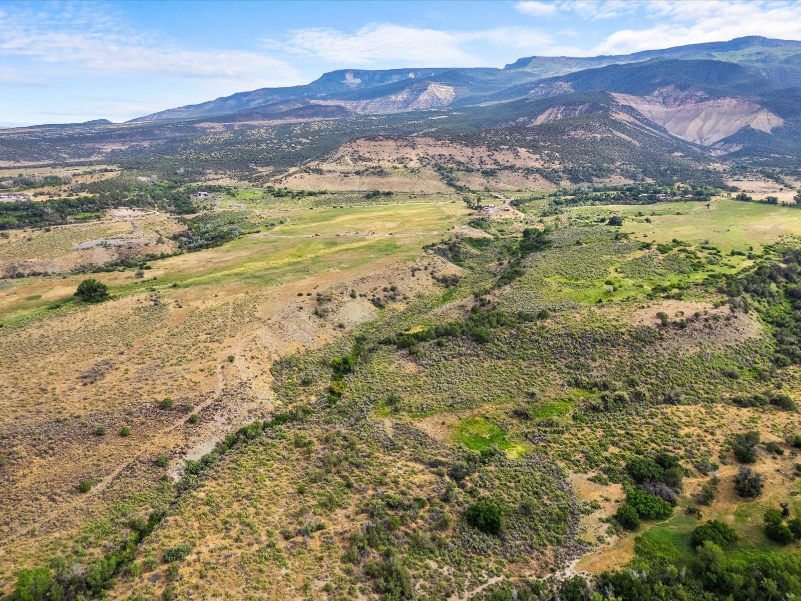 5681 Purdy Mesa Road Whitewater, CO 81527 - Photo 7 of 12 a view of an ocean with a mountain