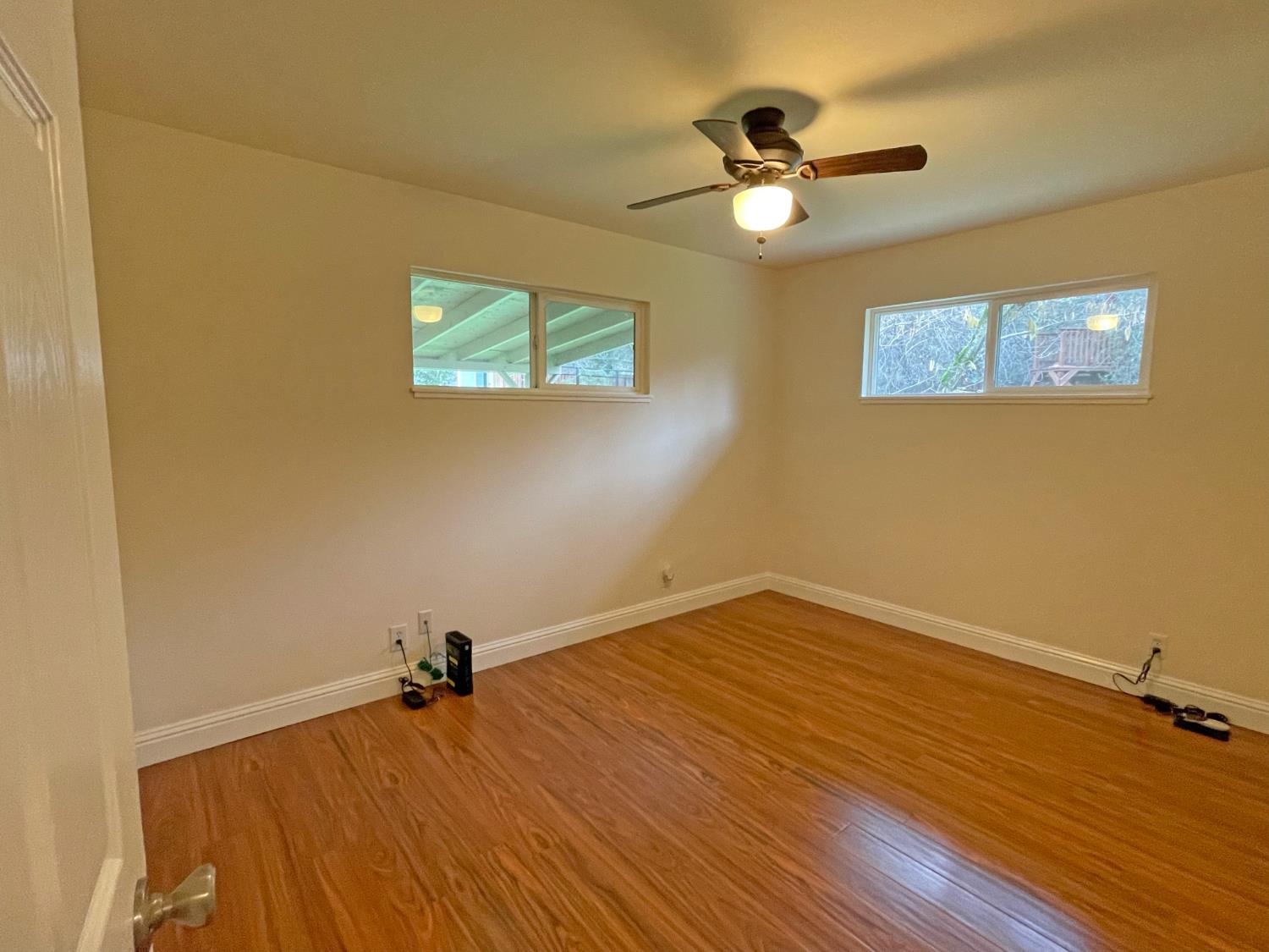 768 Excelsior Road Placerville, CA 95667 - Photo 14 of 17 a view of a room with wooden floor and a ceiling fan