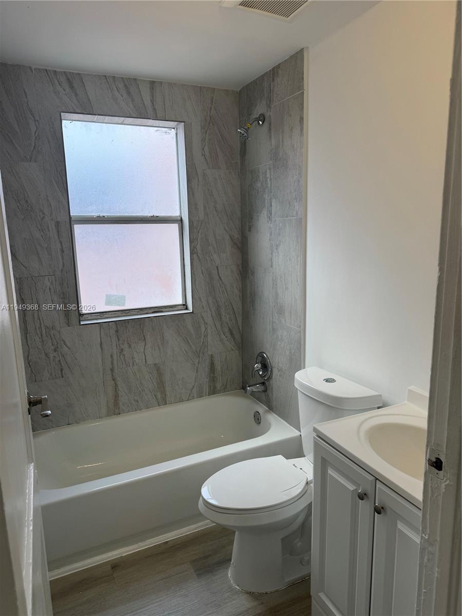 1552 Southwest 2nd Street, Unit 8 Miami, FL 33135 - Photo 5 of 10 a bathroom with a sink toilet and bathtub