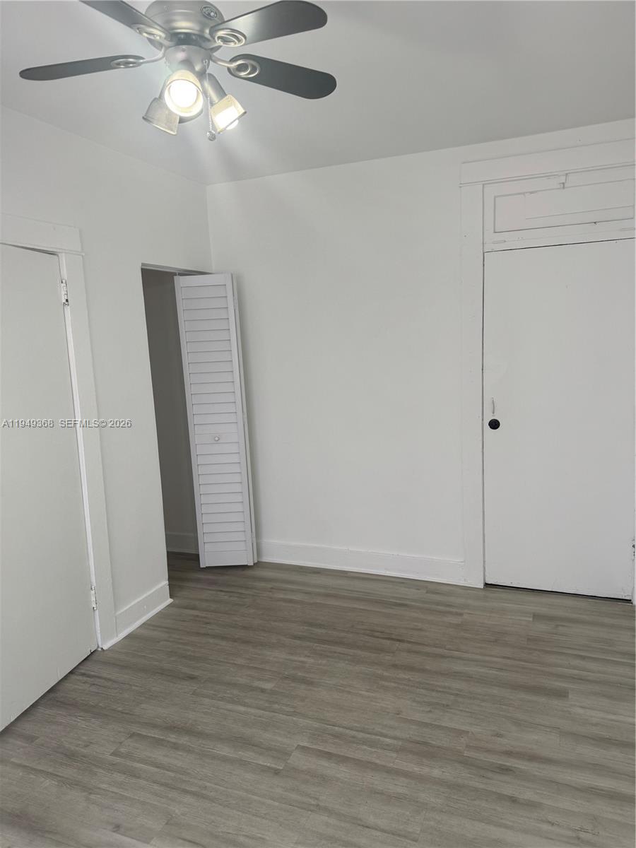 1552 Southwest 2nd Street, Unit 8 Miami, FL 33135 - Photo 6 of 10 a view of an empty room with wooden floor