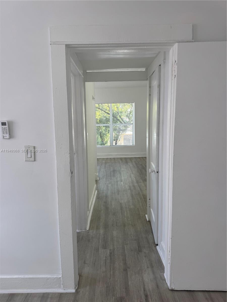 1552 Southwest 2nd Street, Unit 8 Miami, FL 33135 - Photo 8 of 10 a view of hallway with wooden floor