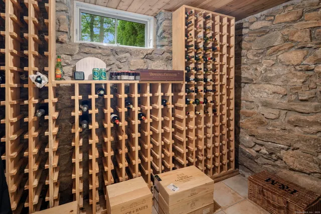 a bathroom with a toilet and a shower curtain