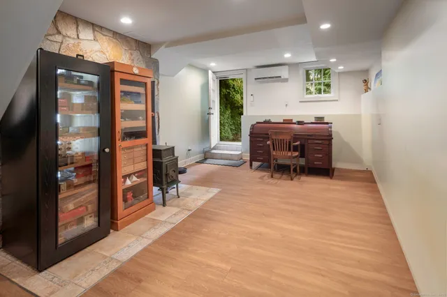 a living room with furniture and a piano