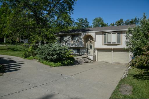 230 North Ela Road Barrington, IL 60010 - Photo 1 of 16 a front view of a house with garden