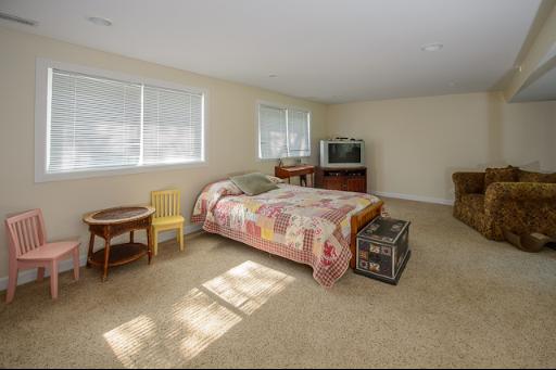 230 North Ela Road Barrington, IL 60010 - Photo 11 of 16 a bedroom with a bed and a couch