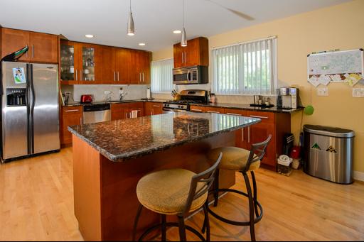 230 North Ela Road Barrington, IL 60010 - Photo 3 of 16 a kitchen with sink a refrigerator and chairs