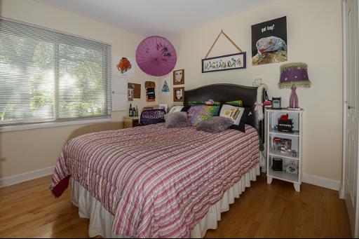 230 North Ela Road Barrington, IL 60010 - Photo 10 of 16 a bedroom with bed and wooden floor