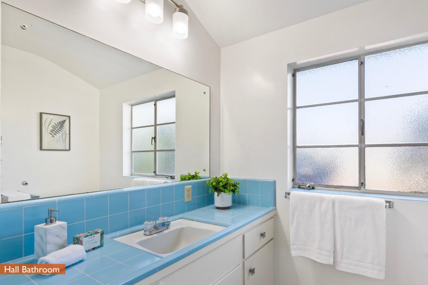 179 Eunice Avenue Mountain View, CA 94040 - Photo 13 of 23 a bathroom with a granite countertop sink a mirror and a window