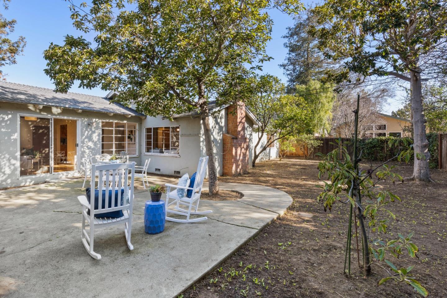 179 Eunice Avenue Mountain View, CA 94040 - Photo 17 of 23 a view of a patio with a table chairs and a fire pit