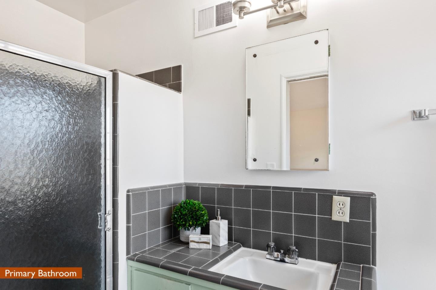 179 Eunice Avenue Mountain View, CA 94040 - Photo 10 of 23 a bathroom with a sink and a mirror