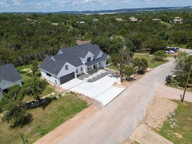 an aerial view of a house with a garden