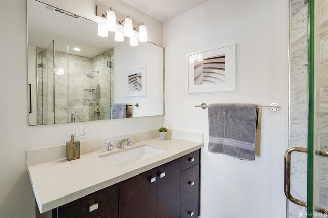 a bathroom with a shower and toilet